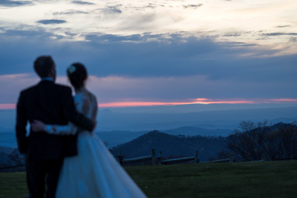 bride and groom watching sunset together after sunset potraits