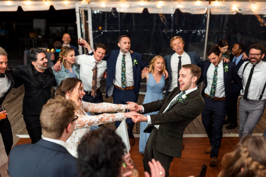 wedding couple dancing together and celebrating recent union