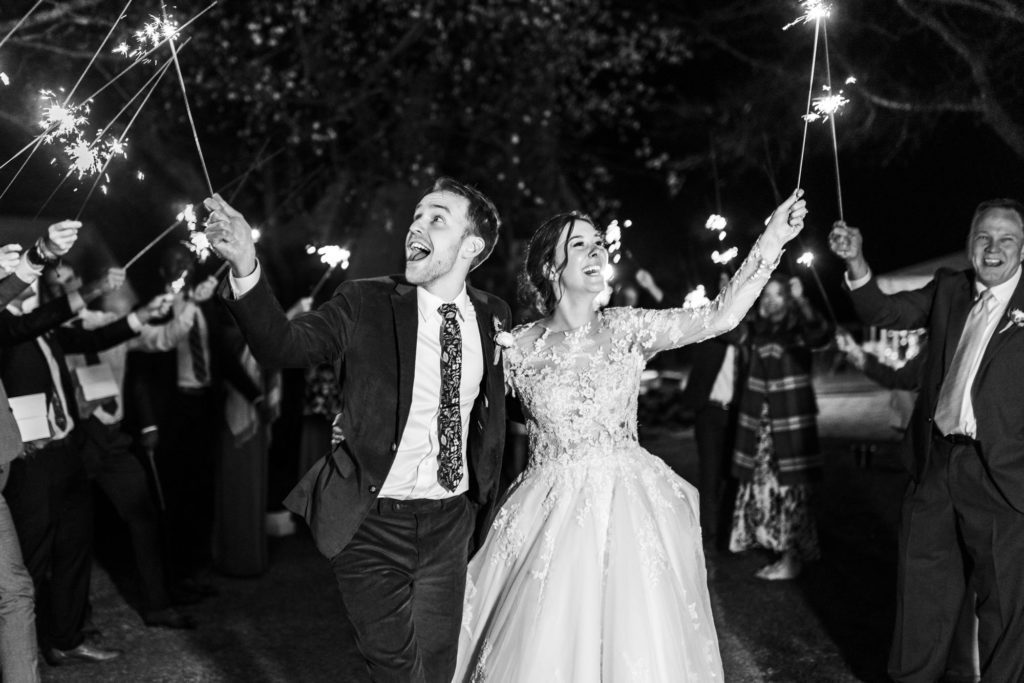 bride and groom exiting as husband and wife during sparkler exit