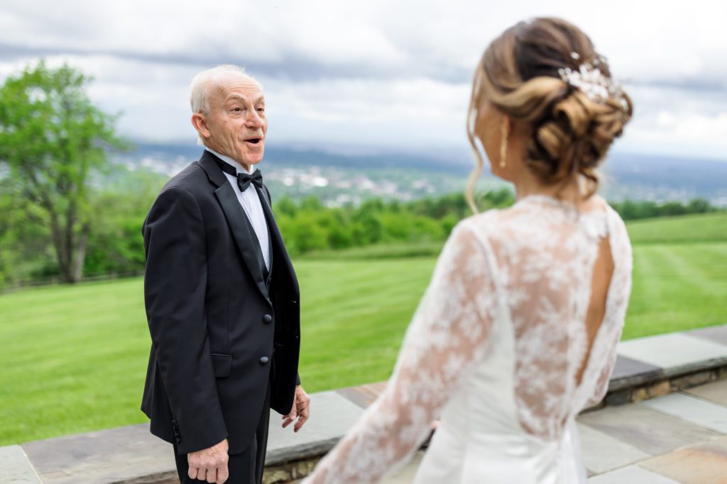 bride walking up to father during first look on wedding day