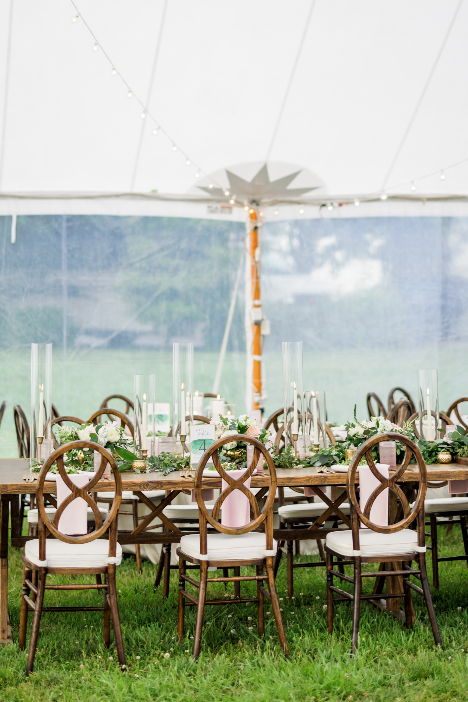 reception set up with wooden table and chairs at spring black tie montalto wedding reception