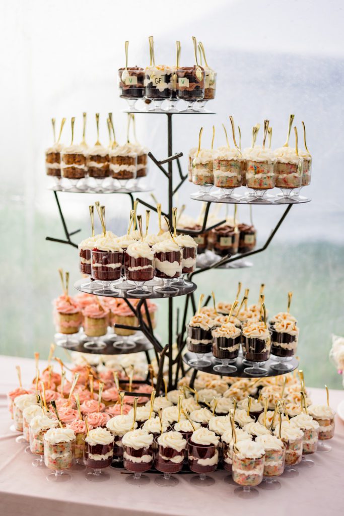 cupcake stand with multiple varieties of cake for dessert 