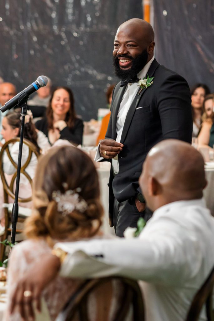 groomsmen giving toast at spring black tie montalto wedding reception
