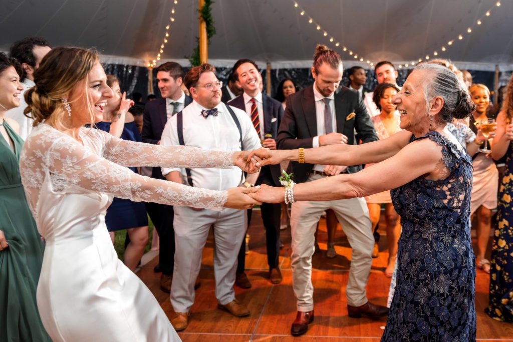 bride dancing with wedding guests 