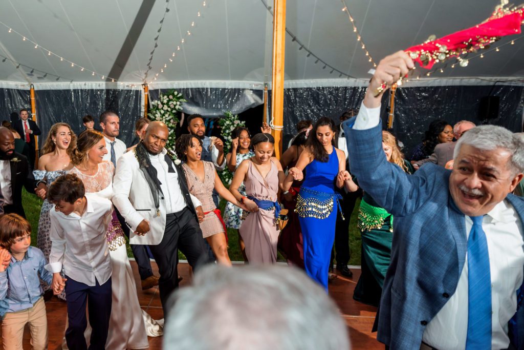 wedding guests celebrating on dance floor