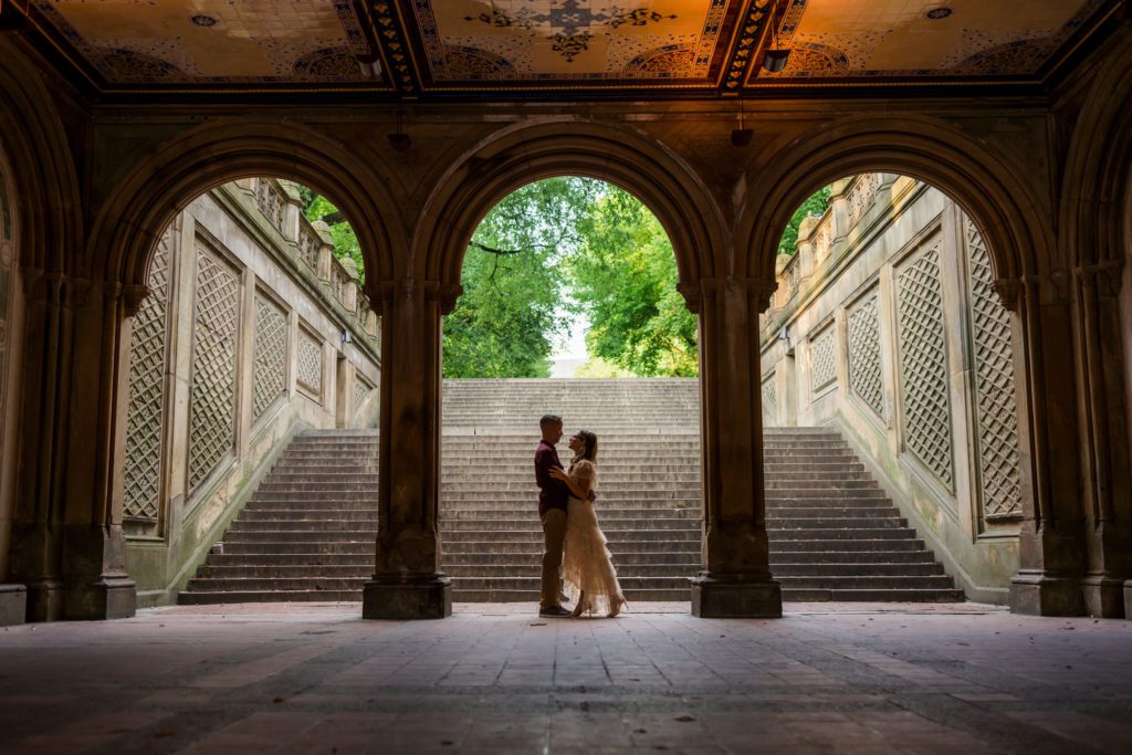 couple embracing at Bethesda Terrace in Central Park during couples session