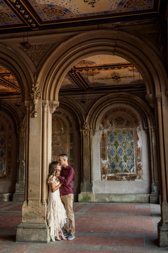 couple standing in Bethesda Terrace during couples session