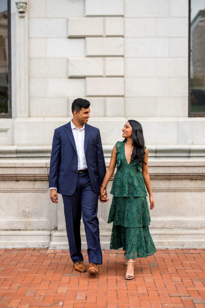 man and woman walking together at elegant richmond engagement session