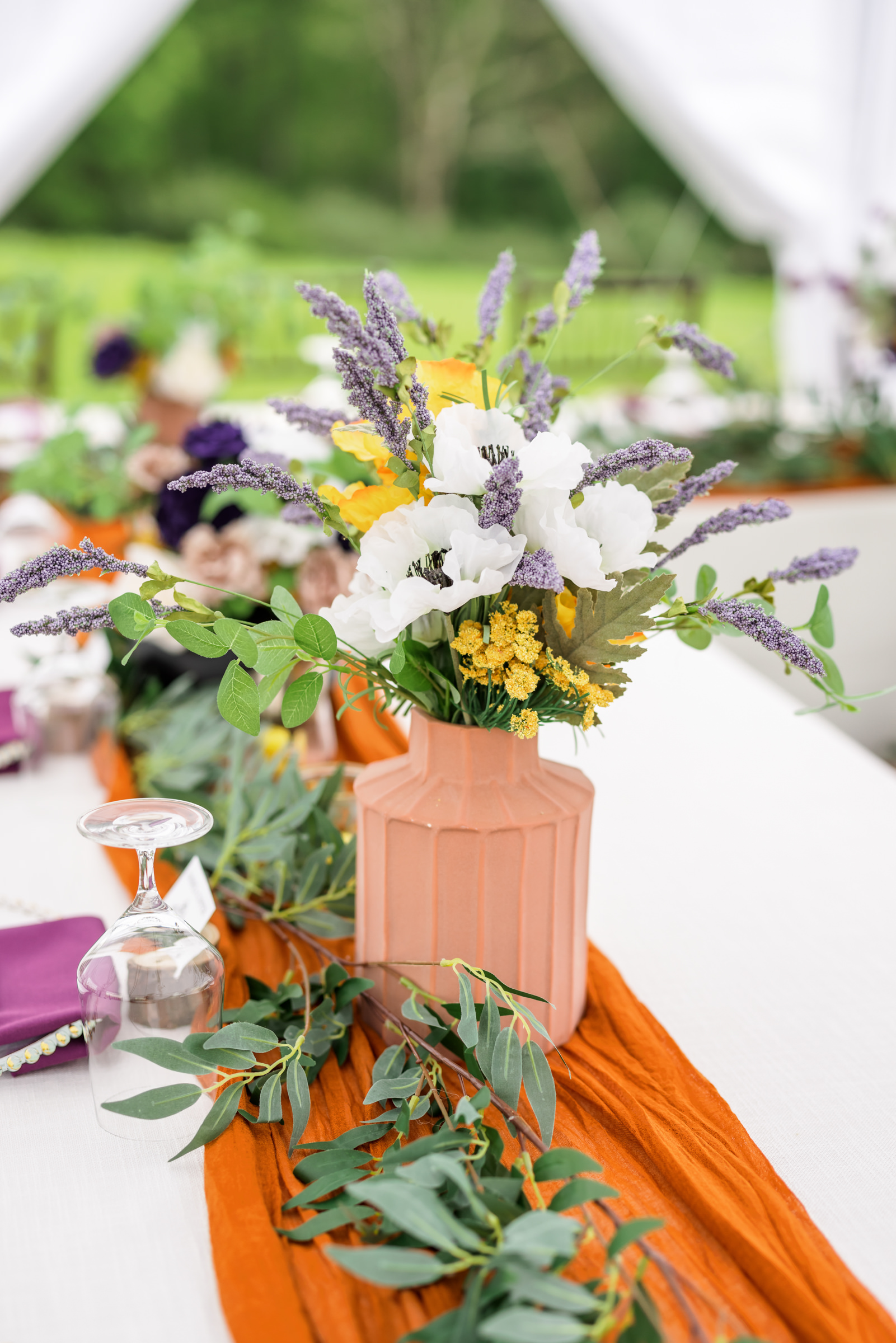 orange runner for wedding tables with flower centerpieces at Lexington Backyard wedding