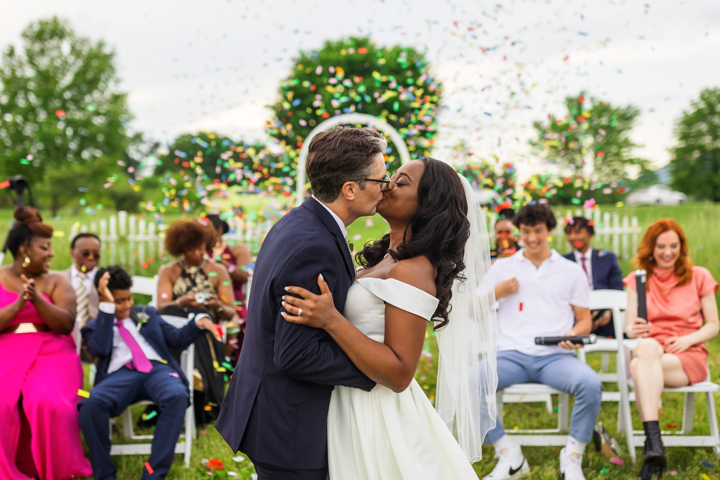wedding couple kiss as husband and wife at Lexington backyard wedding
