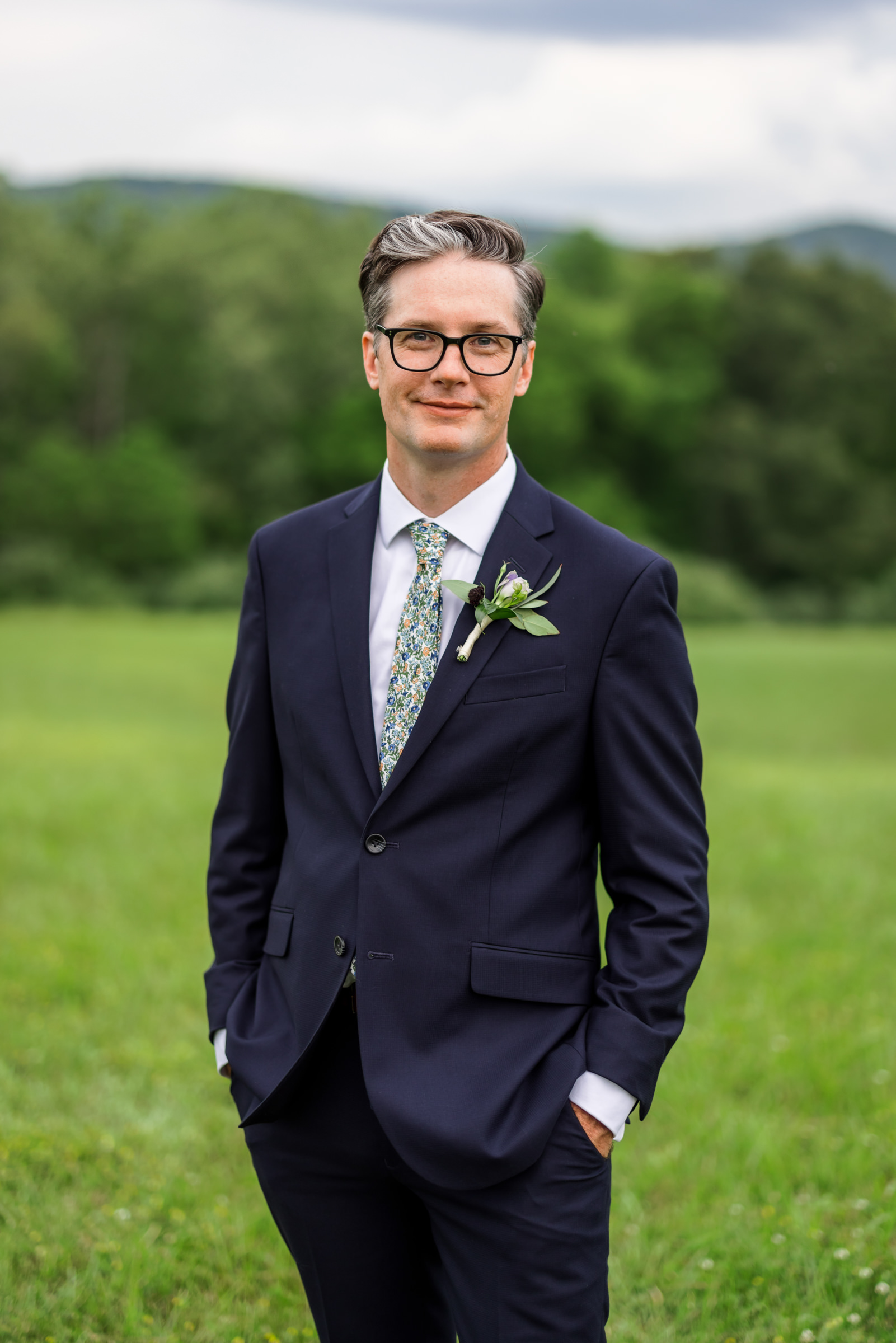groom with hands in pockets 