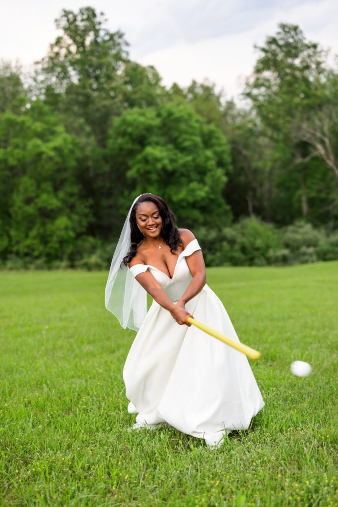 close up of bride playing croquet outside