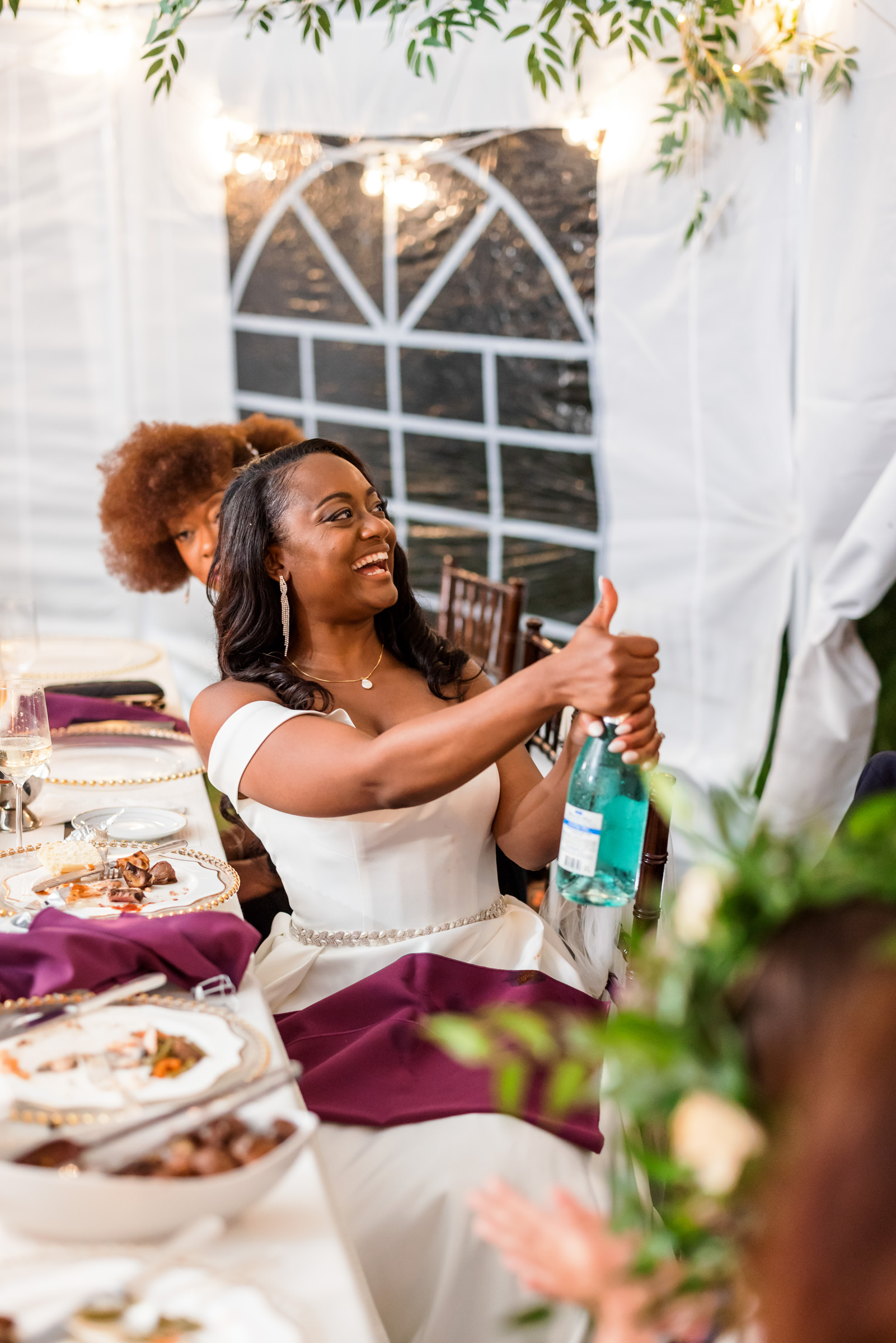 bride popping bottle and celebrating recent wedding