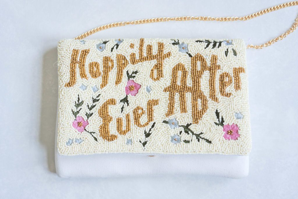 beaded clutch with happily ever after on it at summer virginia house wedding 