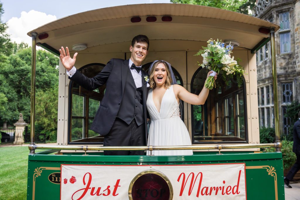 newly married couple riding trolley to reception at virginia house