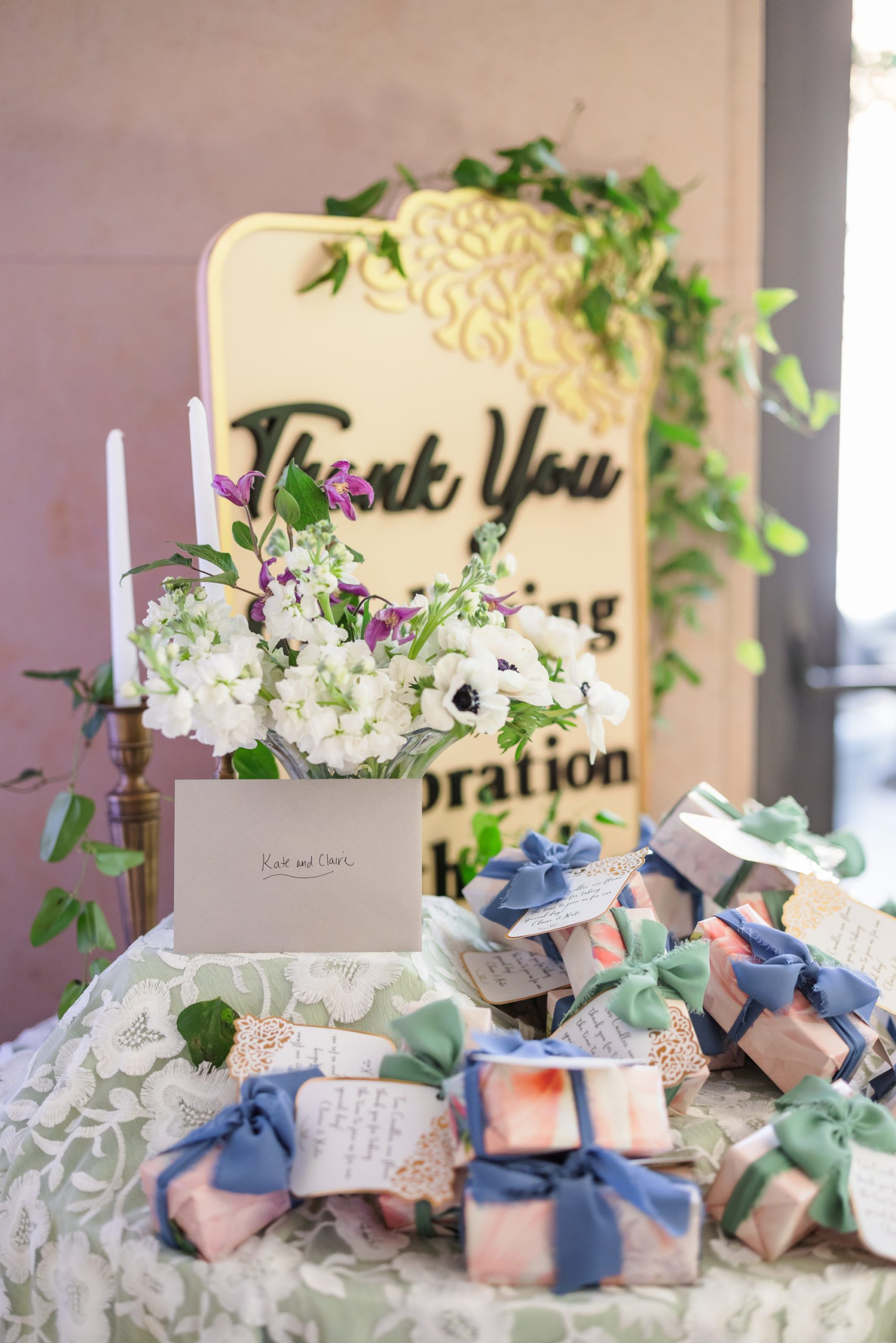 floral centerpiece and wooden 'thank you' sign