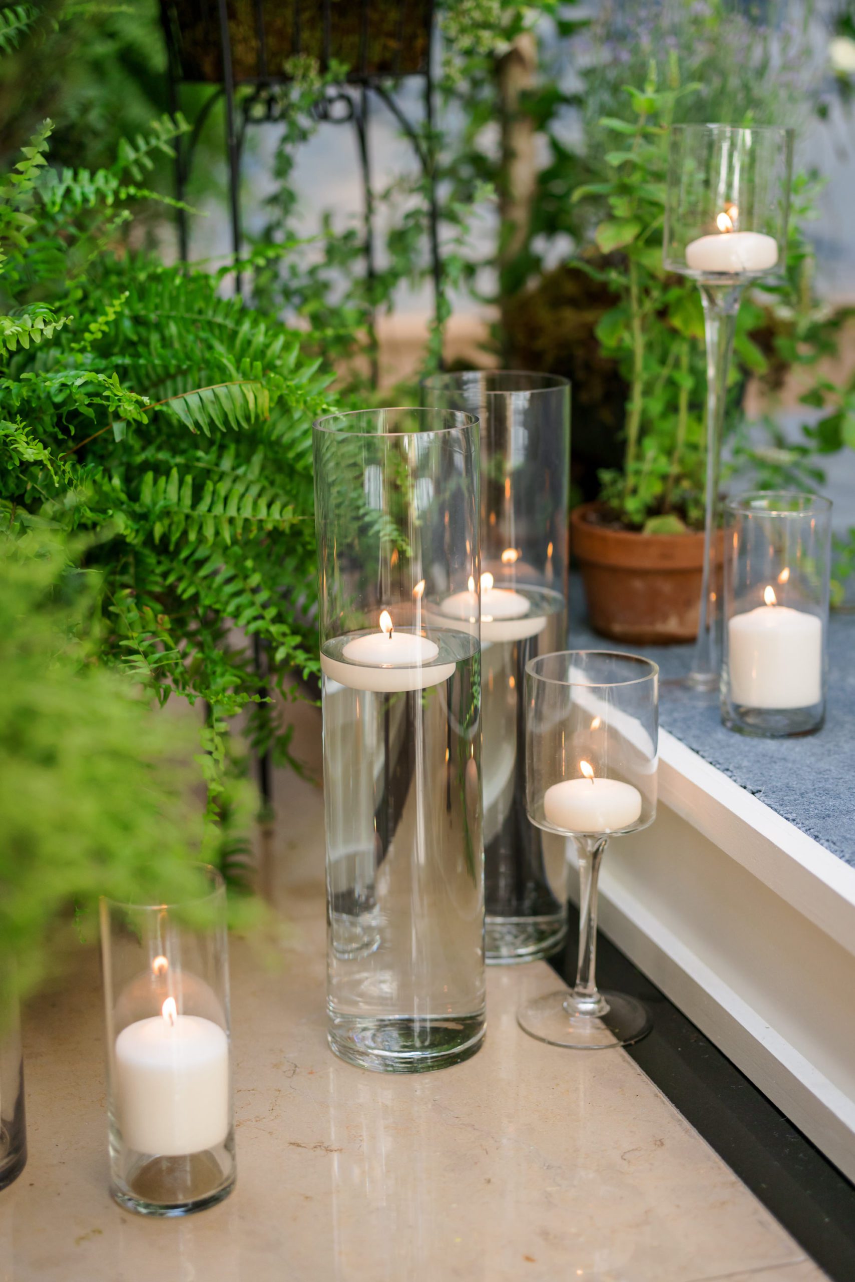 tall candles and greenery at four seasons dc wedding