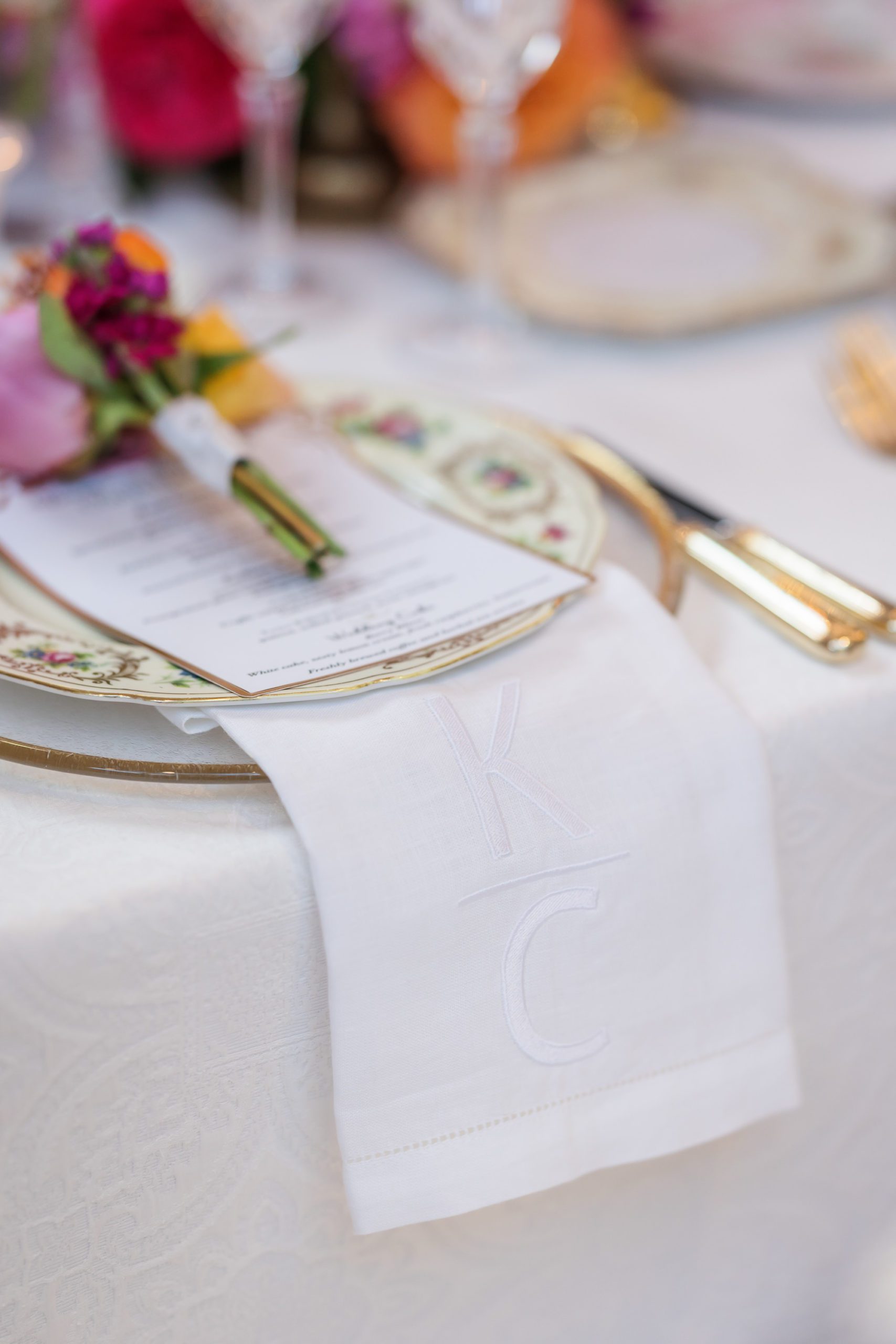 long napkins and white and gold plates