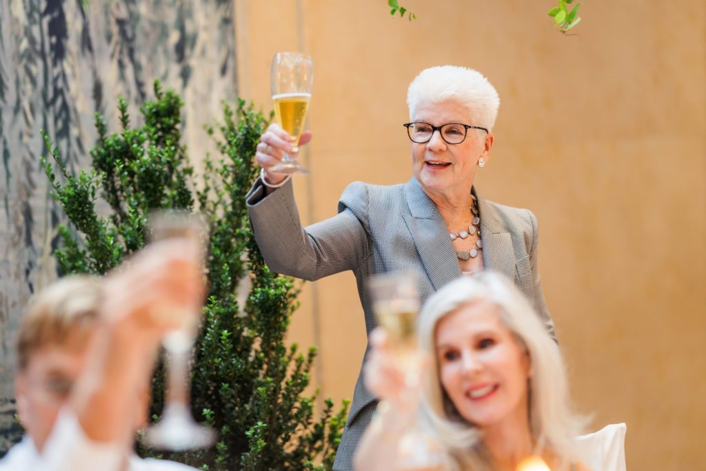 wedding party gives toast at reception
