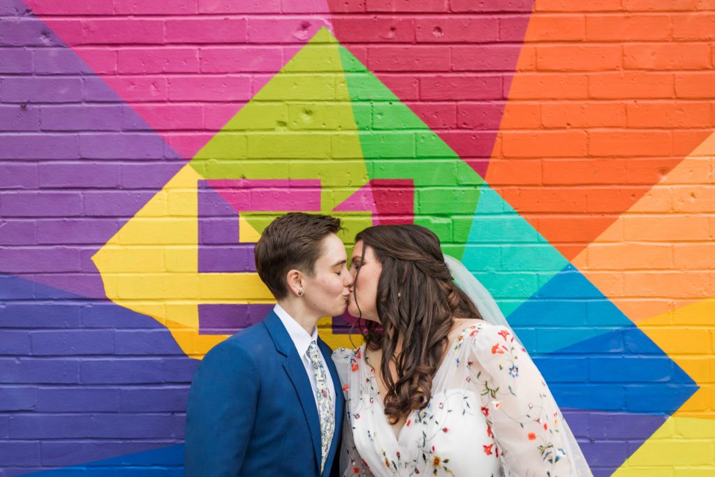 two brides kissing during outdoor portraits