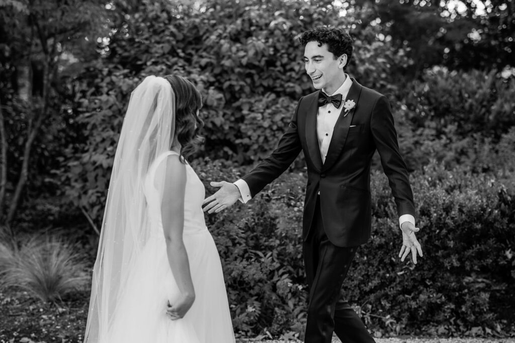 groom seeing bride for first time on wedding day during first look