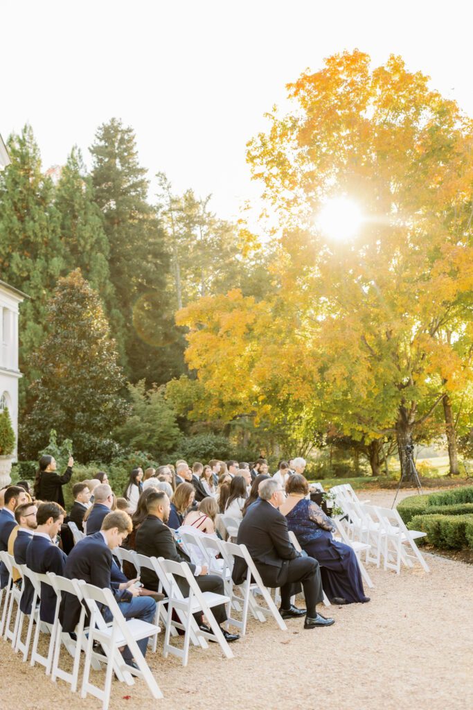 guests sitting in chairs during wedding ceremony before bride and groom walk down the aisle at keswick vineyards wedding
