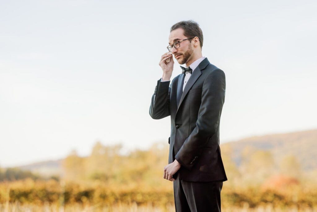 groomsmen crying and wiping tears with kleenex