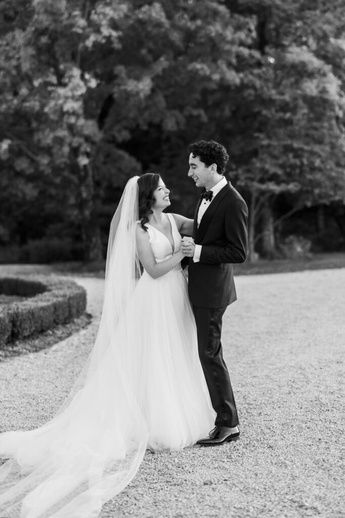 bride and groom dancing together during bridal portraits