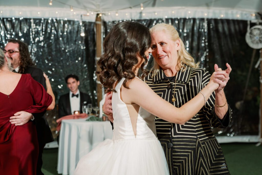 bride dancing with woman on dance floor