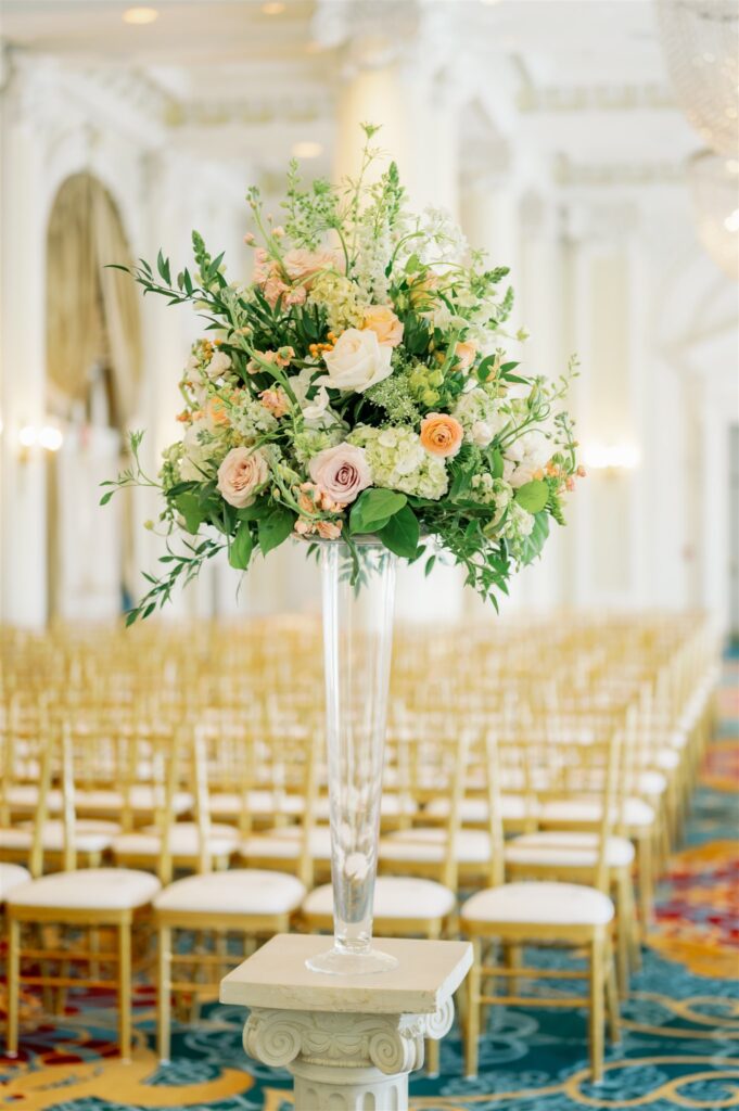 Flowers in vase for wedding ceremony standing on alter before wedding ceremony