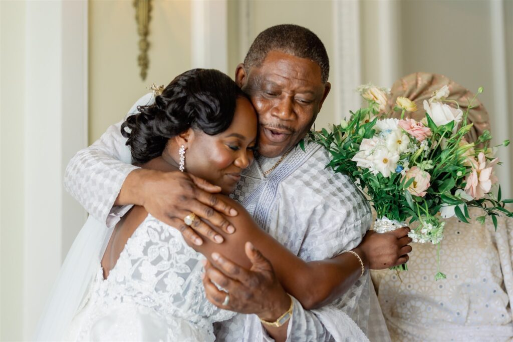 Bride hugging her father before walking down the aisle