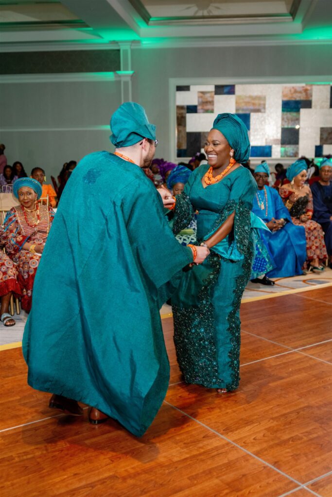 Bride and groom dancing while smiling and laughing together