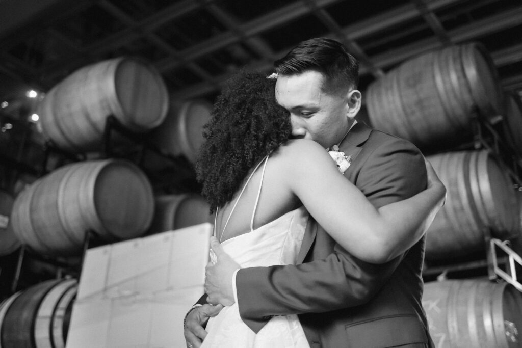 Bride and groom hugging after first look