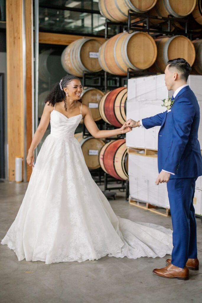 Bride and groom holding hands after first look before wedding ceremony