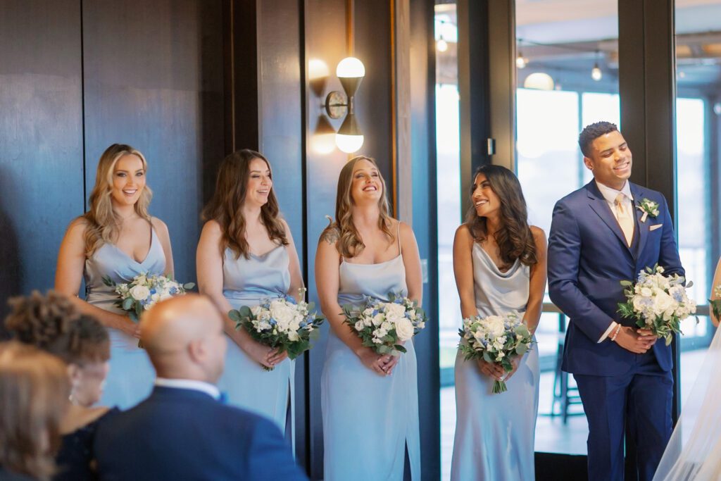 Bridesmaids laughing during ceremony