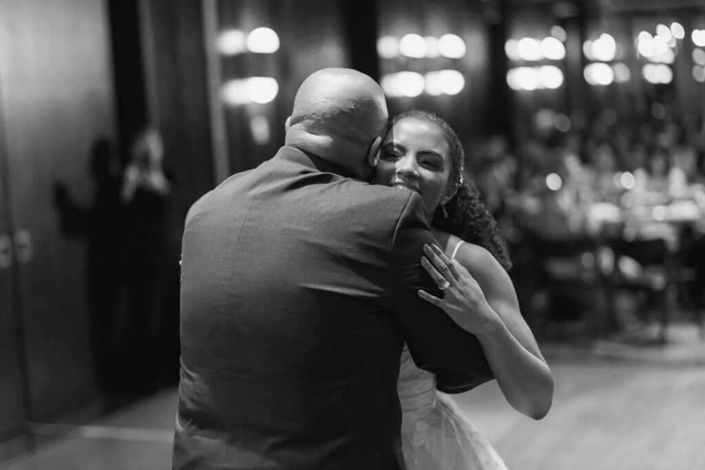 Bride dancing with father during father daughter dance at reception